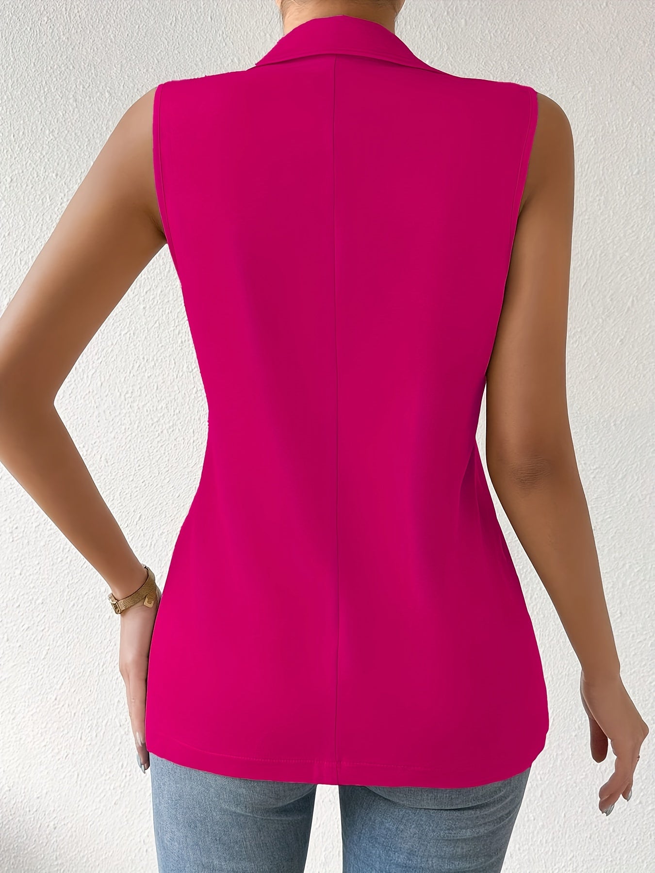 Sleeveless button front lapel vest in a solid color, suitable for spring and fall. Ideal for women's clothing.