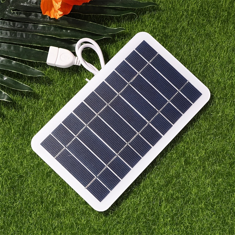 Portable USB solar panel charger for outdoor use, ideal for camping, travel, and emergencies. Charges mobile phones, flashlights, and fans. White solar charger with USB ports for on-the-go