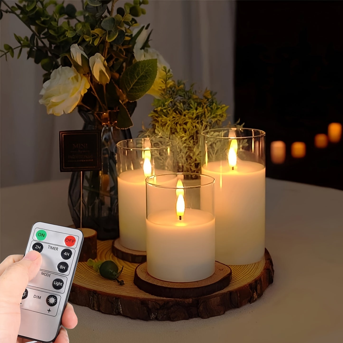 Remote controlled LED candle set with battery operated candles in three different sizes (10.16cm, 12.7cm, 15.24cm) and timer function. Ideal for home decor, parties, and festive occasions.