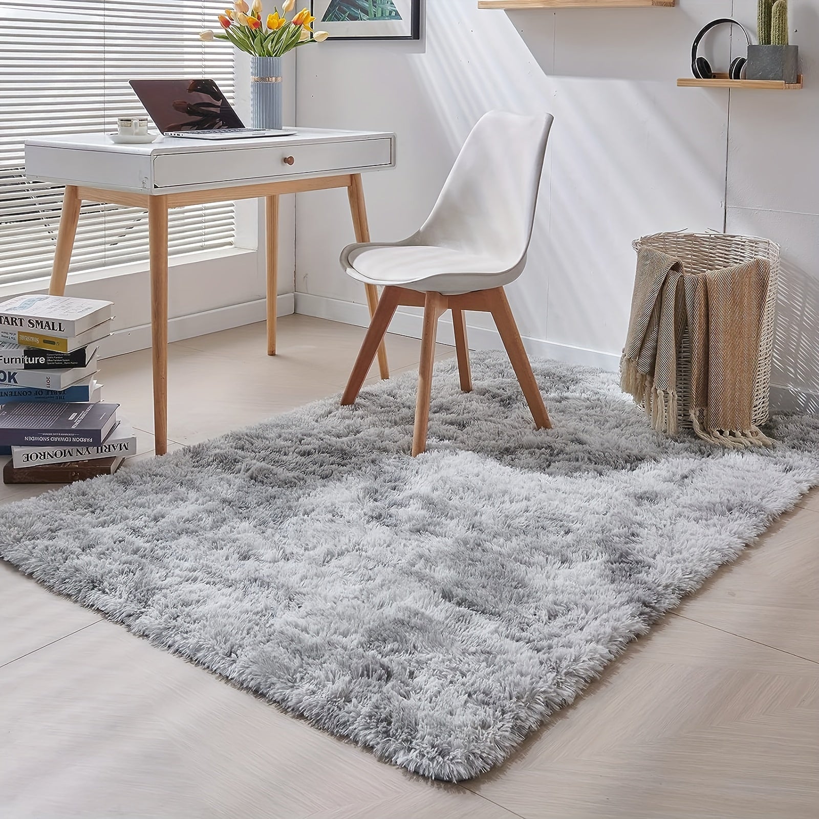 This high-quality plush shag area rug features a 5cm high pile and weighs 900g/sqm. It is machine washable and has a non-slip backing, making it perfect for use in bedrooms, living rooms, and offices. This rectangle polyester indoor carpet meets the