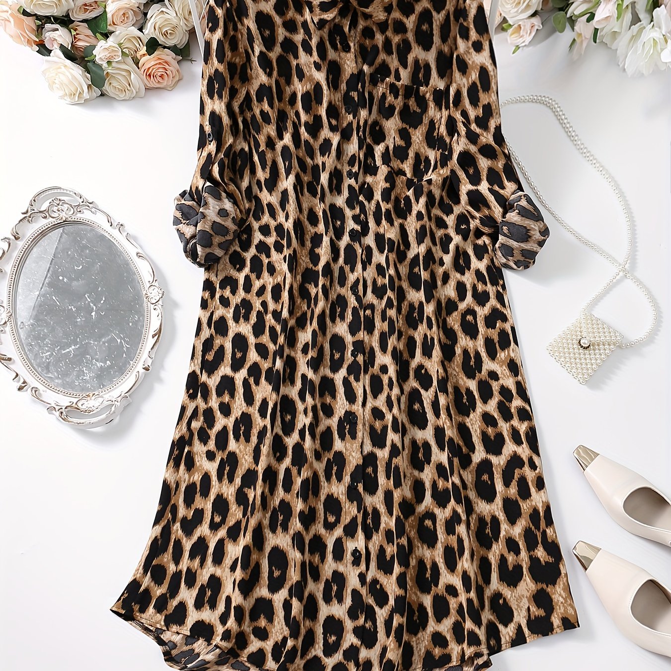 Leopard print button-up shirt dress with rolled sleeves, ideal for spring and autumn.