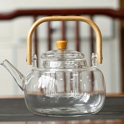 Glass teapot with bamboo handle and removable infuser, 34oz capacity. Made of heat-resistant clear borosilicate glass. Ideal for brewing loose leaf tea.