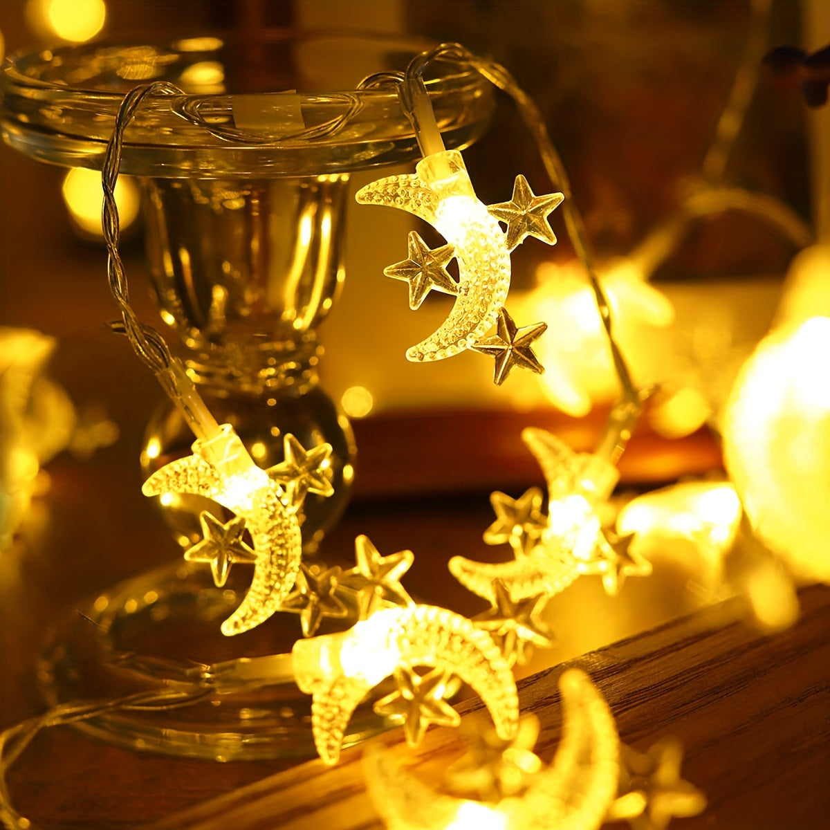 Battery powered star and moon light string for home decor, suitable for various festive decorations.