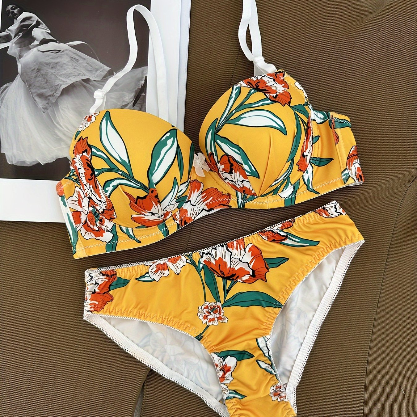 Floral bra and panty set with steel underwire and breast enhancement feature for women.