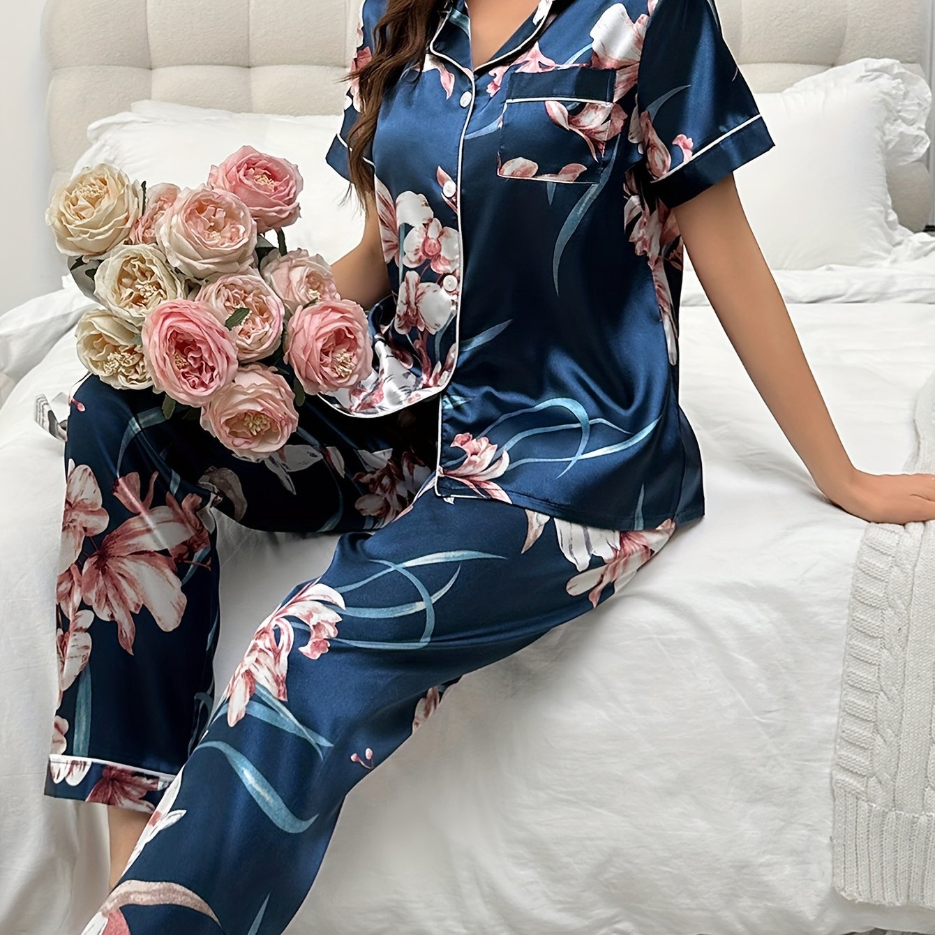 Women's floral print pajama set with short sleeve button top and elastic waistband pants, perfect for sleepwear or loungewear.