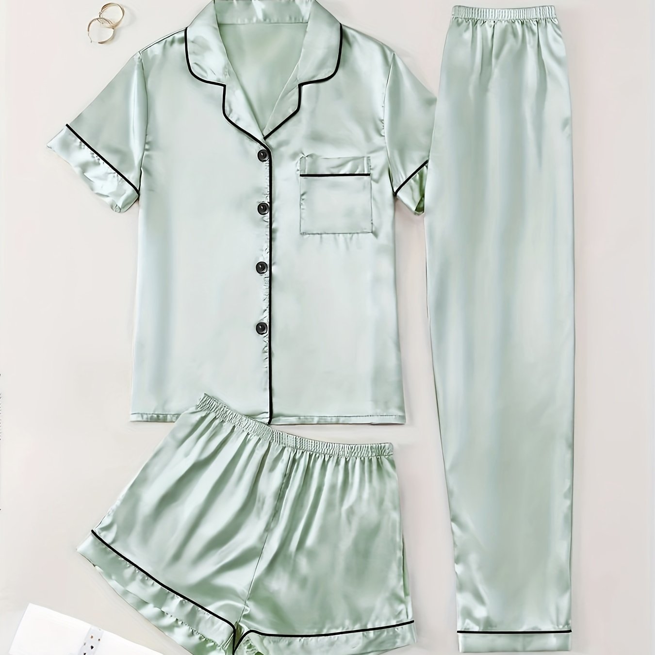 3-piece summer satin pajama set for women featuring collared shirt, long pants, and shorts. Made of 95% polyester and 5% elastane. Available in sizes S-XL.