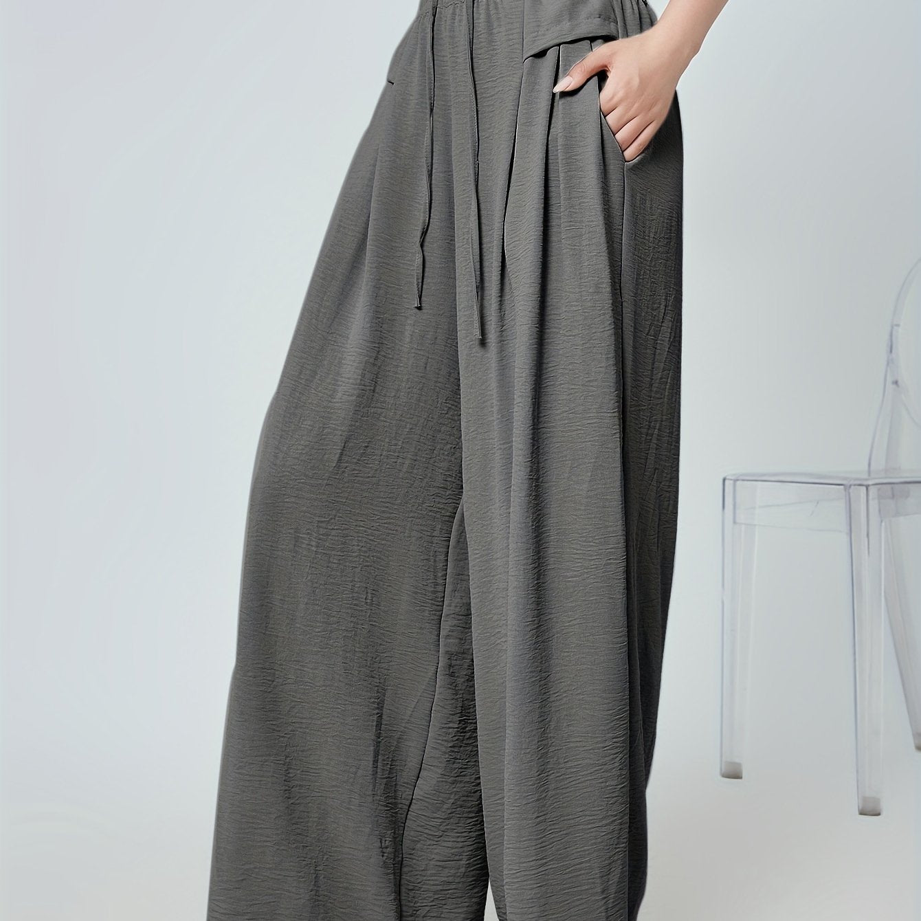 Stylish lounge bottoms with elastic drawstring, pleated detail, and wide leg fit for women's loungewear.