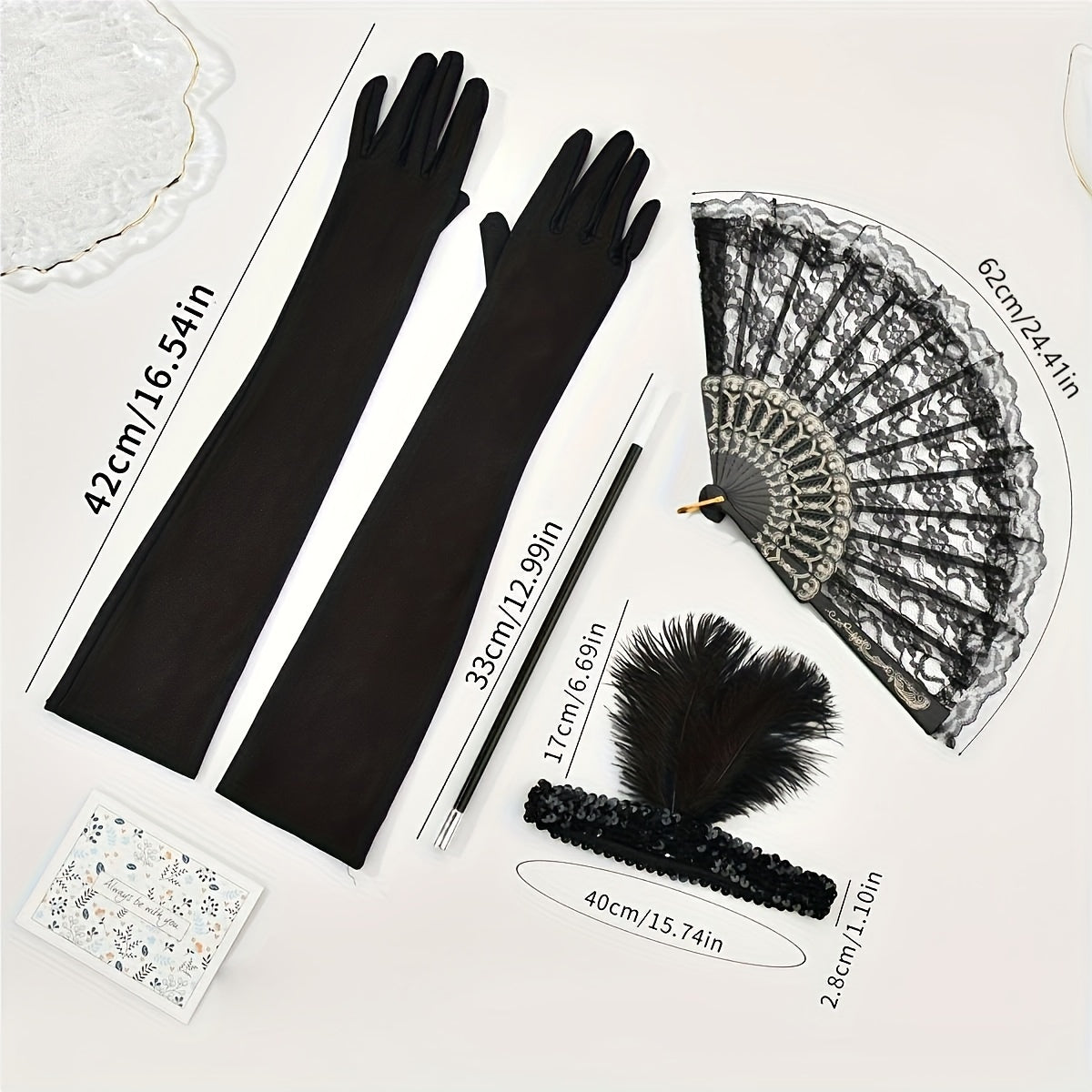 A collection of 1920s masquerade party accessories including gloves, faux feather hair clips, smoke tube fans, and other dress embellishments for women.