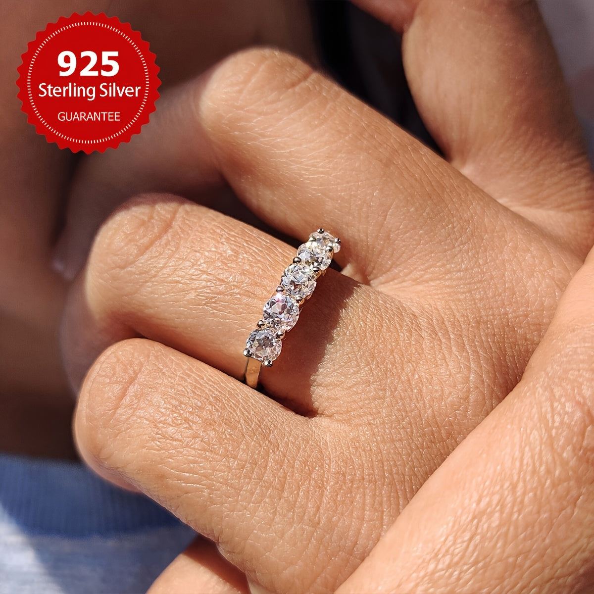 A stunning engagement ring with 7 pieces of 0.3 carat Moissanite set in S925 pure silver. This hypoallergenic ring is perfect as a promise ring or eternal ring, ideal for anniversaries and Valentine's Day. It makes a luxurious gift for women, with