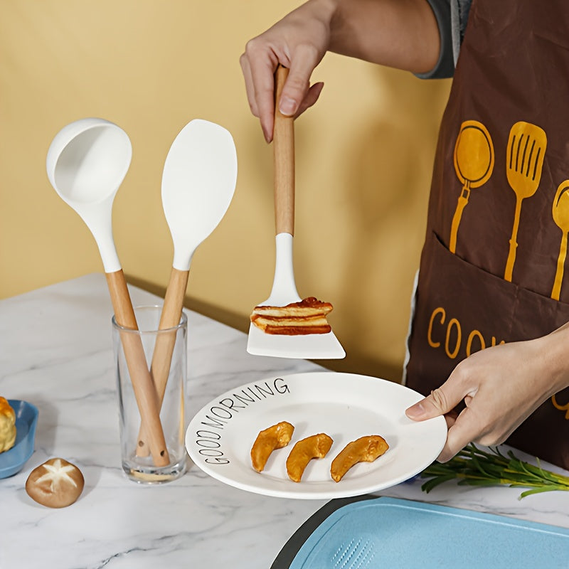 38-piece set of silicone utensils with wooden handles, designed for safe and non-stick cooking. This modern cookware collection is washable and includes all the kitchen essentials and gadgets you need.