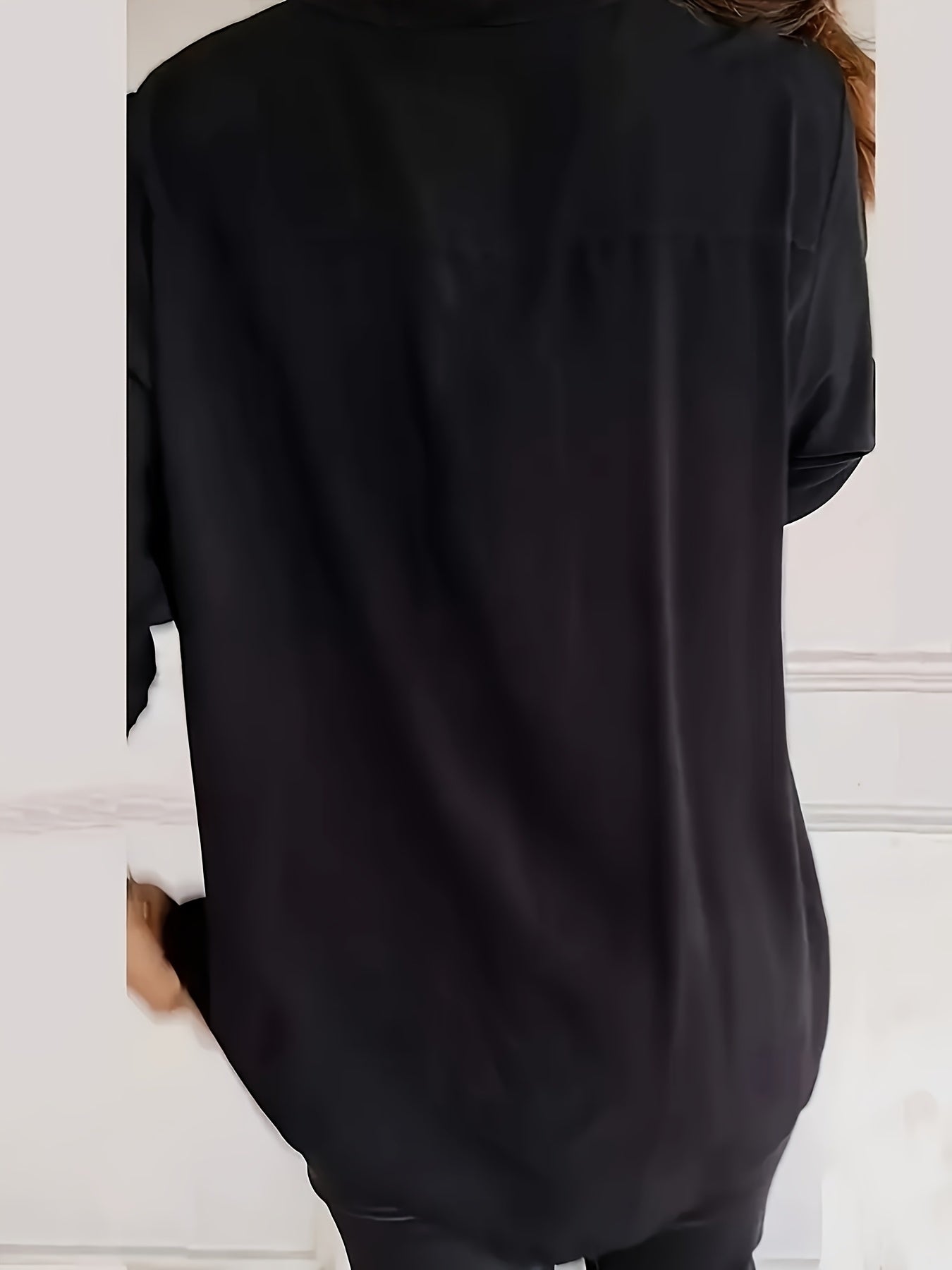 Casual loose V-neck shirt with sequin details, solid color, long sleeves, and an elegant irregular hem for women in spring and autumn.