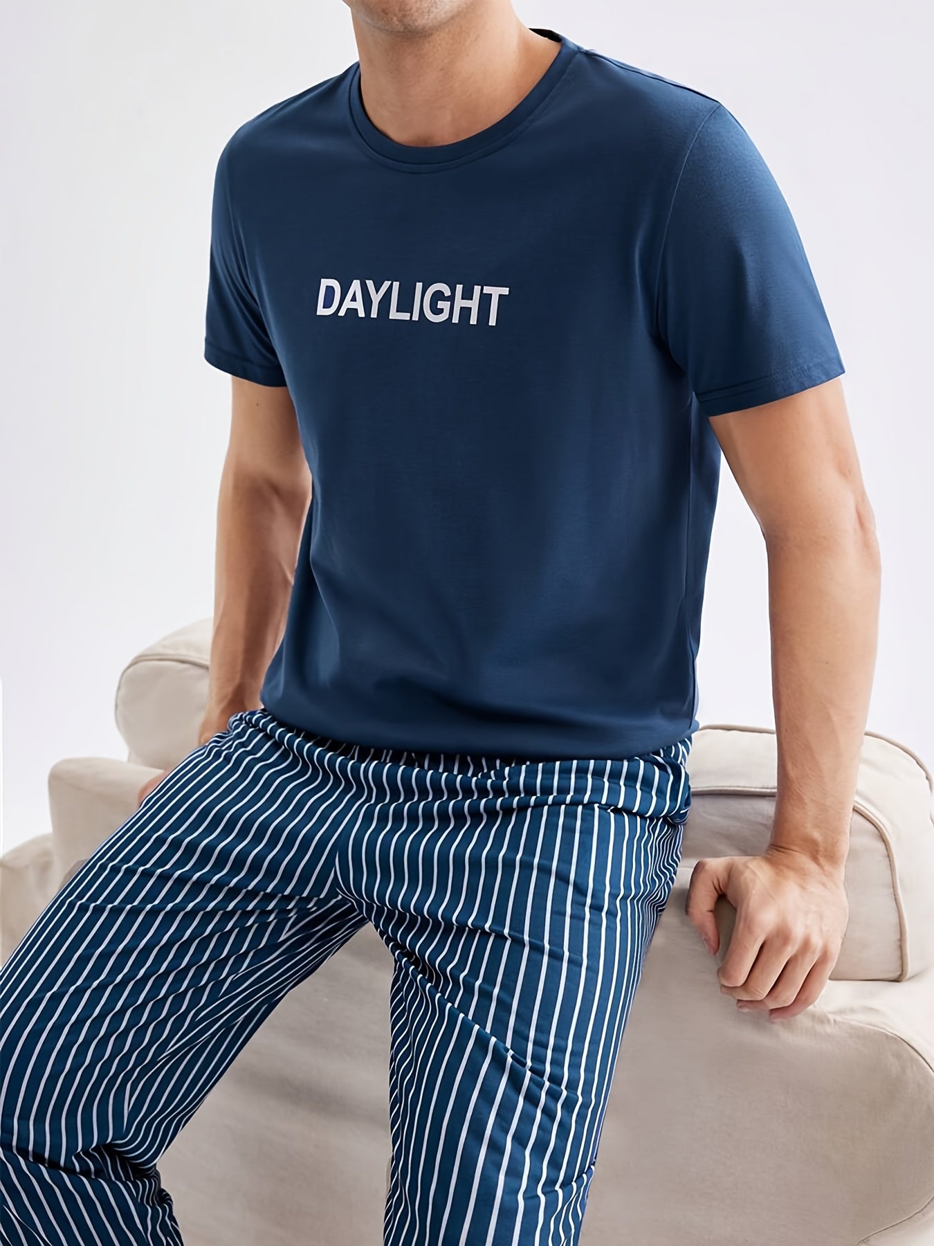 Men's Casual Crew Neck Short Sleeve Pajama Set with Striped Pants, made of 100% Polyester Knit Fabric, with Slight Stretch for All Season Comfort.