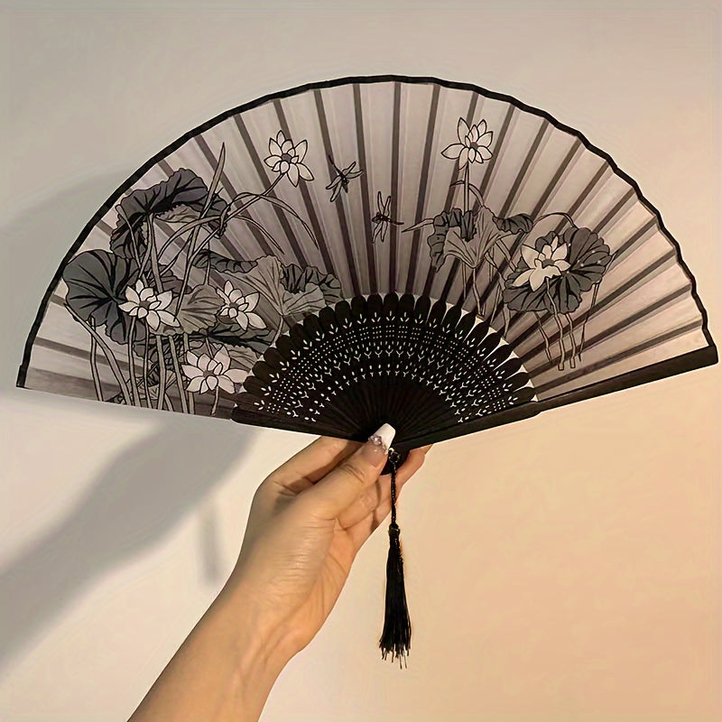 Asian-inspired bamboo hand fan with plant design - perfect for home decor, dance, or as a gift.