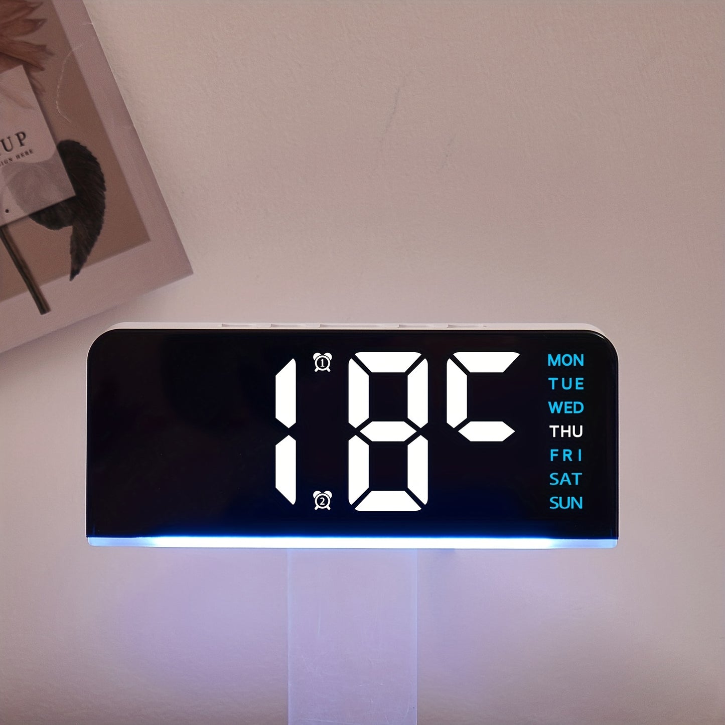 Digital LED Alarm Clock with USB power, sleek black plastic frame, dual time display, modern design for bedroom decor. Battery-operated (AAA not included).