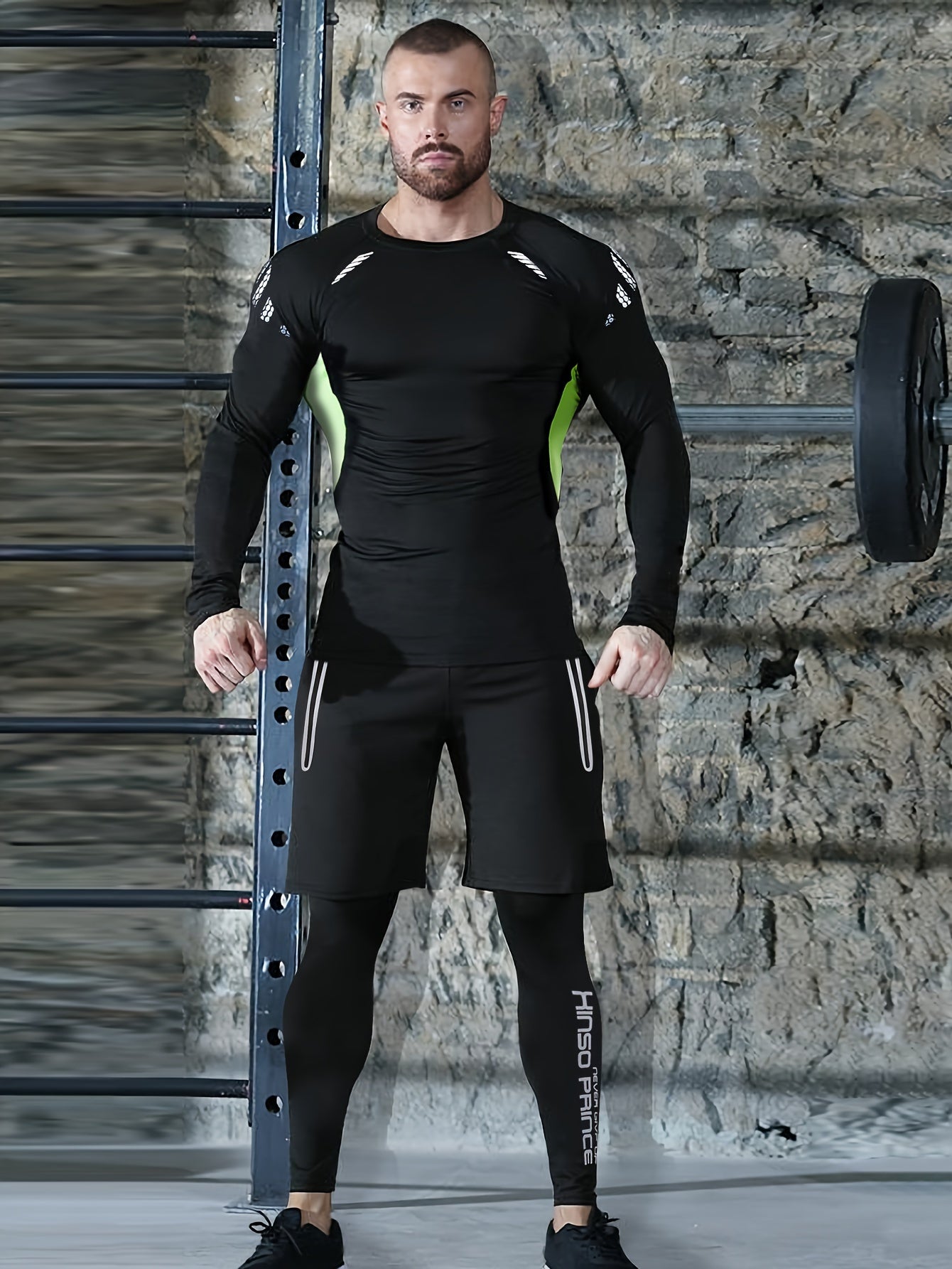 Men's athletic set includes quick-dry, stretchy compression gear with long sleeve top, shorts, jacket, and leggings in black and green. Made of polyester/spandex blend. Perfect for gym