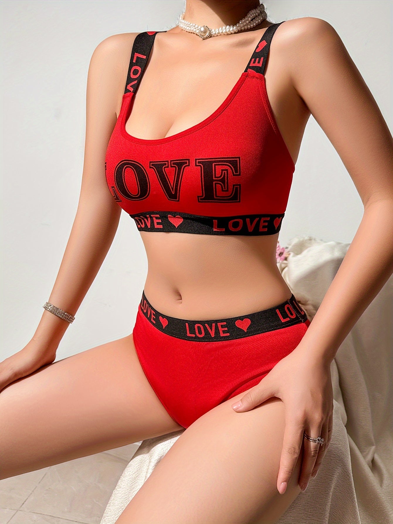 Set of LOVE letter sports bra with matching belt.