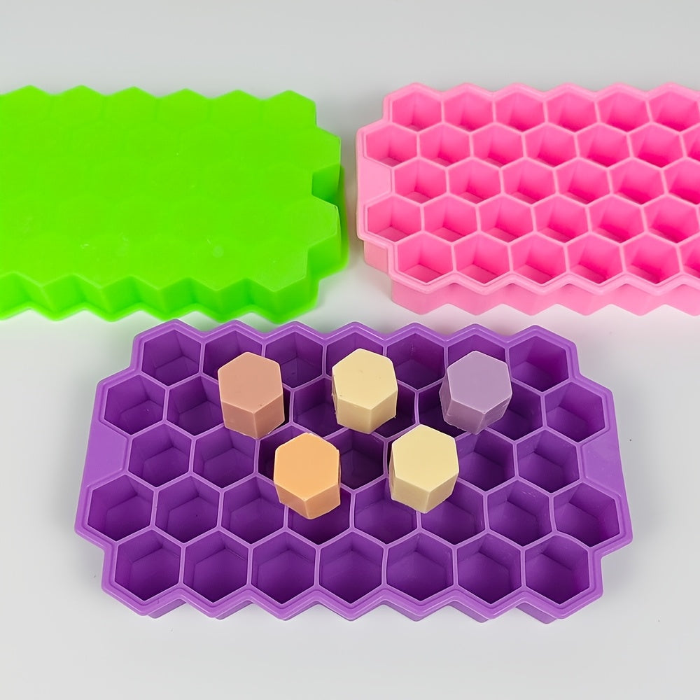 The Silicone Honeycomb Ice Tray is designed with 37 compartments and a lid for easy storage. Made of durable silicone, this tray is perfect for creating hexagonal ice cubes and can also be used for making chocolate, wax bottles, and candy. The flexible