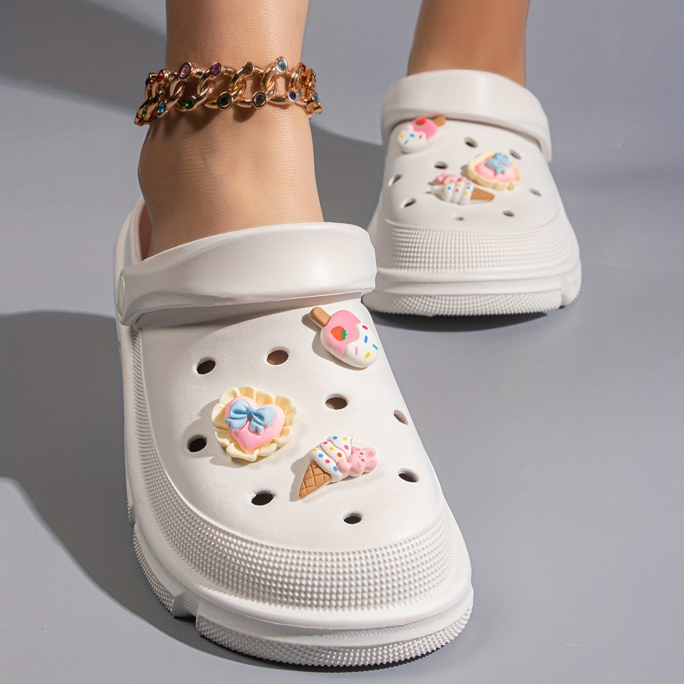 Women's cute cartoon clogs with round toe and breathable design for comfortable wear.