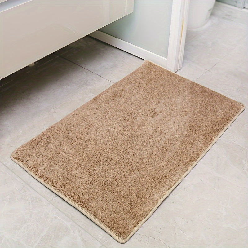 Machine-made oblong bath rug made from quick-dry absorbent knit fabric with non-slip features. Crafted from polyester fiber, this rug is 1.8cm thick and has a weight of 780gsm. Suitable for entryways, bedrooms, living rooms, and garages. Easy to care for