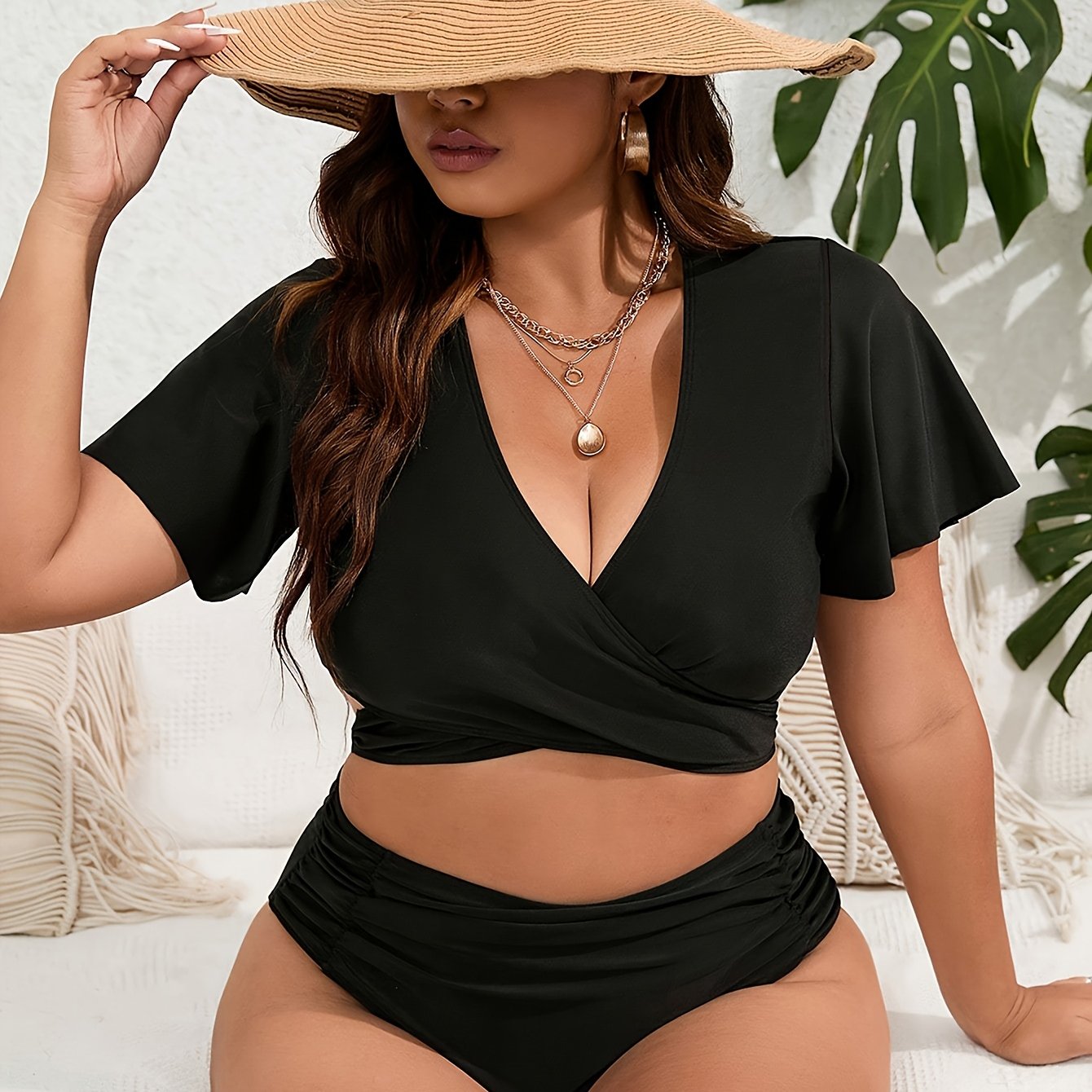 High-waisted solid color bikini with fly sleeves in a larger size.