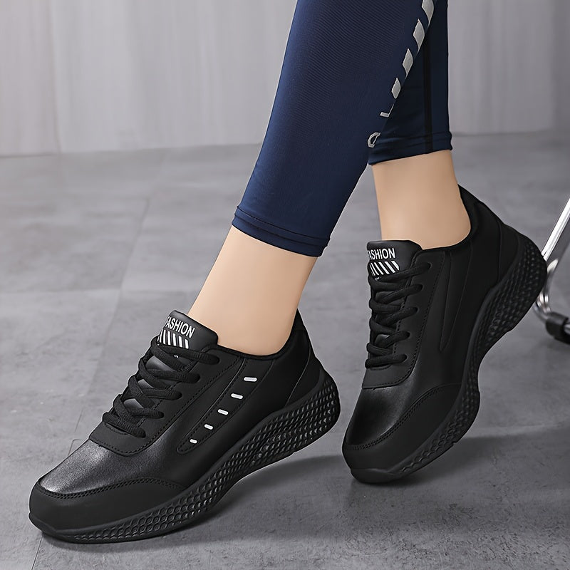 Black platform sneakers for women with lace-up design and comfortable fit, suitable for outdoor activities.