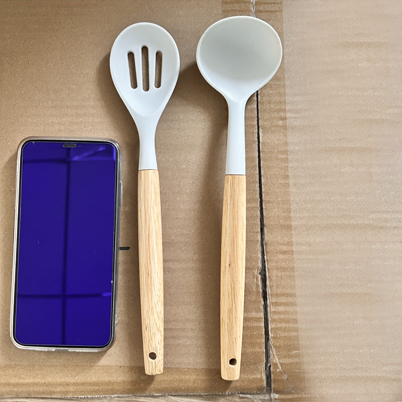 Set of 12 pieces of silicone tableware, including kitchen utensils and cookware for safety. This set features wooden handles on the non-stick cookware for easy use and cleaning. Modern and washable kitchen supplies, including small tools and essentials.