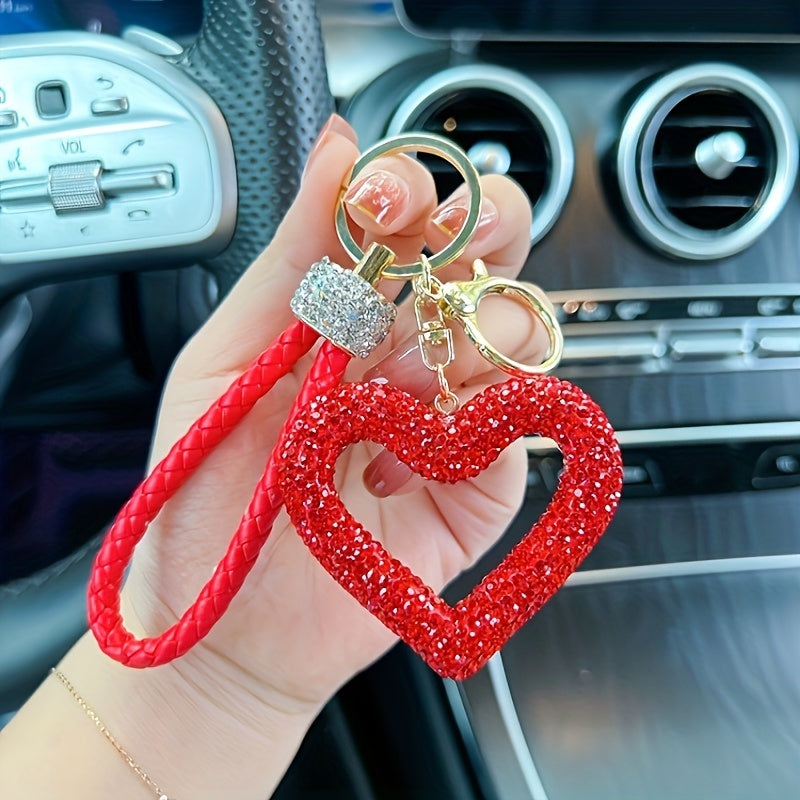 Heart-shaped resin keychain adorned with sparkling rhinestones, featuring a fun cartoon design for a touch of whimsy. Complete with a lobster clasp for easy attachment, this unique keyring is perfect for adding a festive touch to your holiday decor.