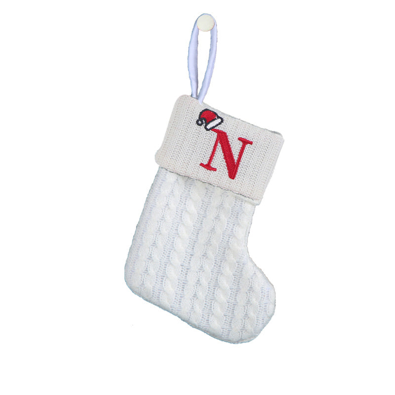 White cable knit stocking with embroidered 'F' - Ideal for indoor decor.