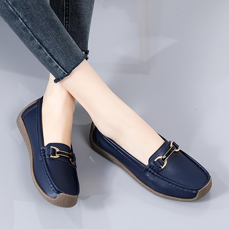 Women's slip-on flats with solid color, plain toe, and non-washable man-made materials.