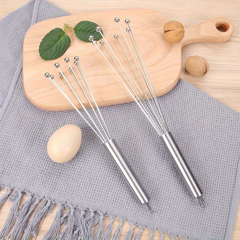 One piece or two pieces of a 25.4cm/30.48cm stainless steel ball whisk, perfect for mixing eggs, creams, and other ingredients in the kitchen during baking.