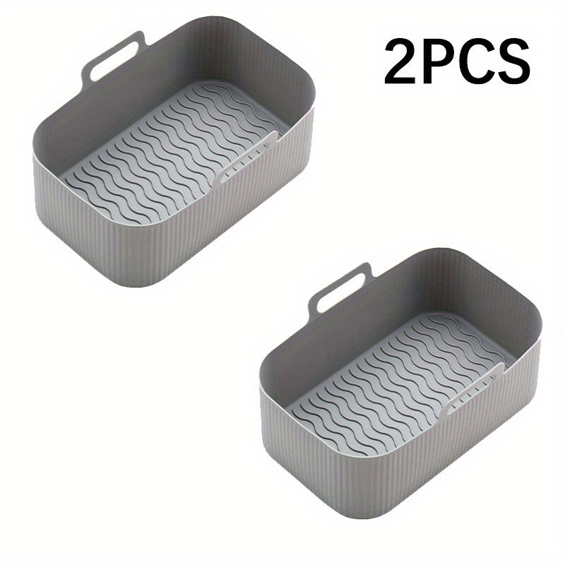 Set of 2 Silicone Air Fryer Liners in a rectangular shape (19.48cm X 12.5cm) for your NINJA DZ201 air fryer. These liners can be used as pots, basket bowls, and baking trays, making them versatile and reusable kitchen accessories. Perfect for baking and