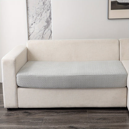 Modern gray sofa cushion cover with elastic fit and soft textured fabric. Machine washable for enhanced comfort in the living room.