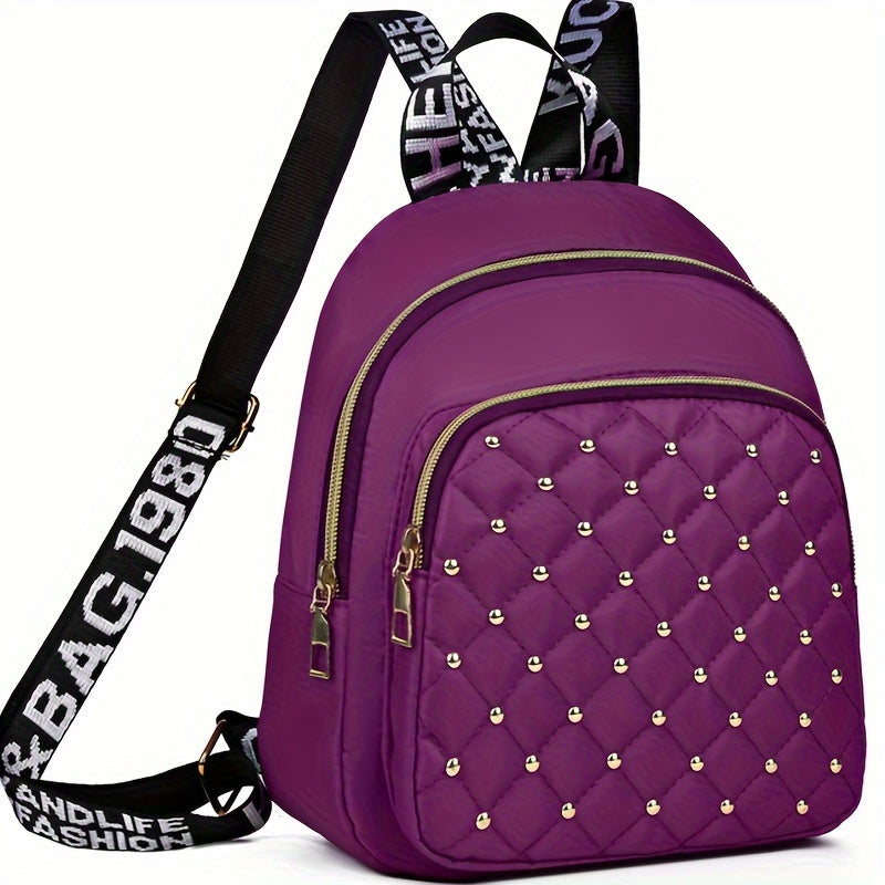 Stylish nylon backpack with rhinestone embellishments, lightweight, tassel detail, adjustable straps, and polyester lining. Suitable for daily commute or fashionable travel for women 15