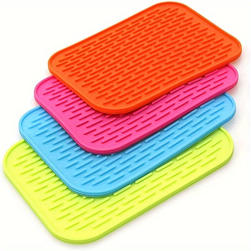 High-quality silicone drying mat for dishes, heat-resistant and non-slip, protects kitchen surfaces, versatile trivet, 21.59cm x 16.0cm, come in vibrant colors.