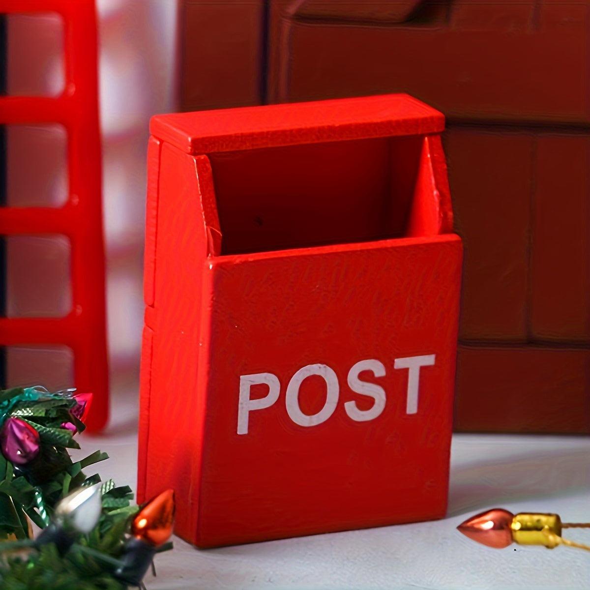 Red miniature wooden mailbox for 1:12 dollhouses with "POST" label, indoor use, no power required. Perfect for living room decor.