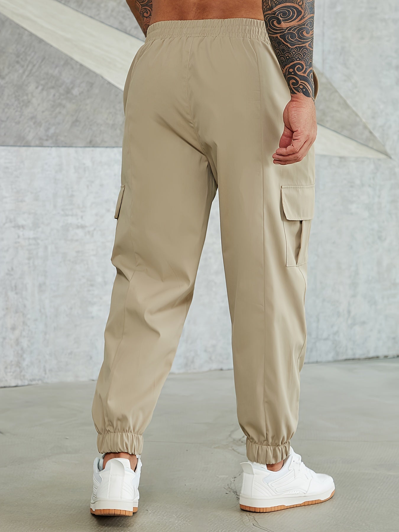 Solid cargo pants for plus size men, ideal for sports and outdoor activities.