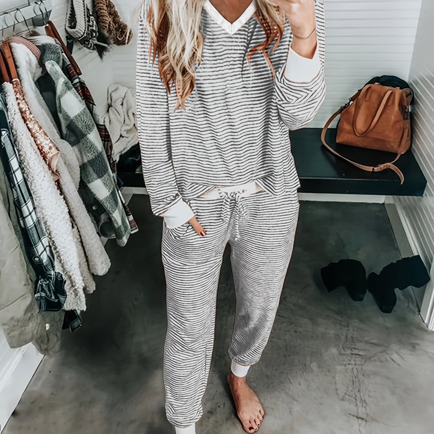 Striped V-neck knit loungewear set with long sleeves and pants.