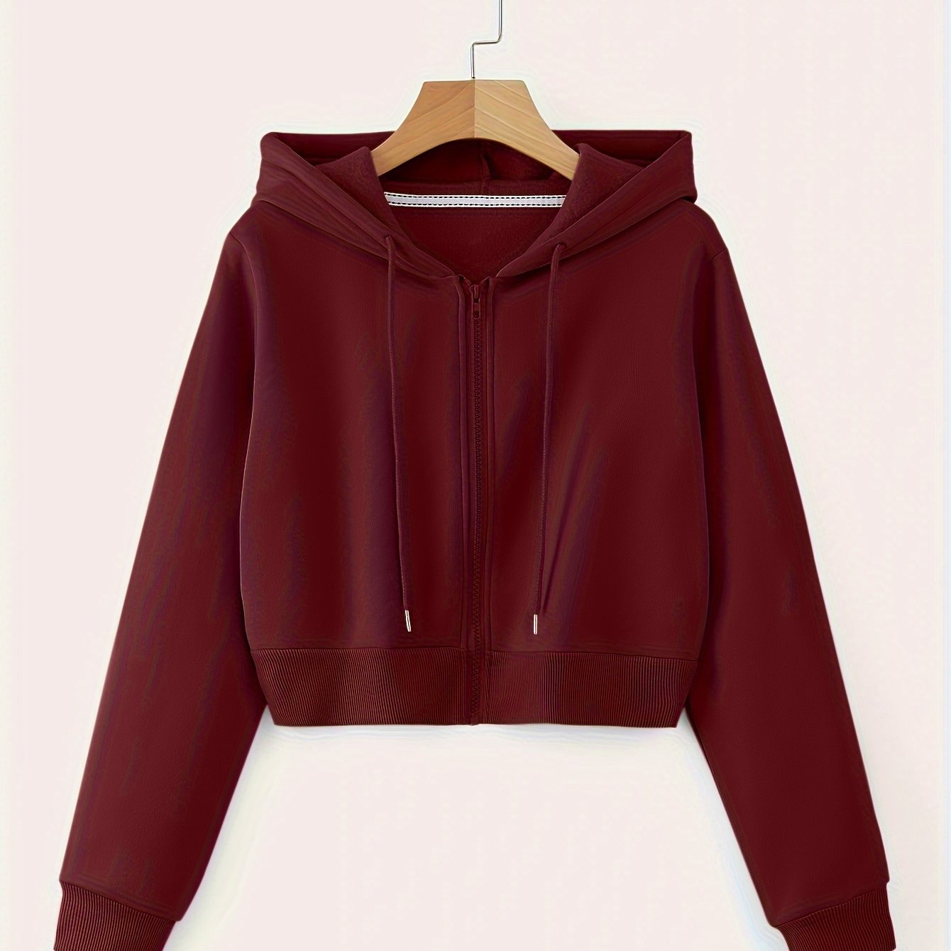 Spring and fall women's cropped drawstring hoodie with long sleeves.