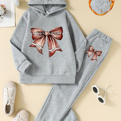 Cozy and stylish girls' 2-piece set featuring fleece-lined hoodie with bow design and matching joggers, ideal for fall/winter and outdoor activities.