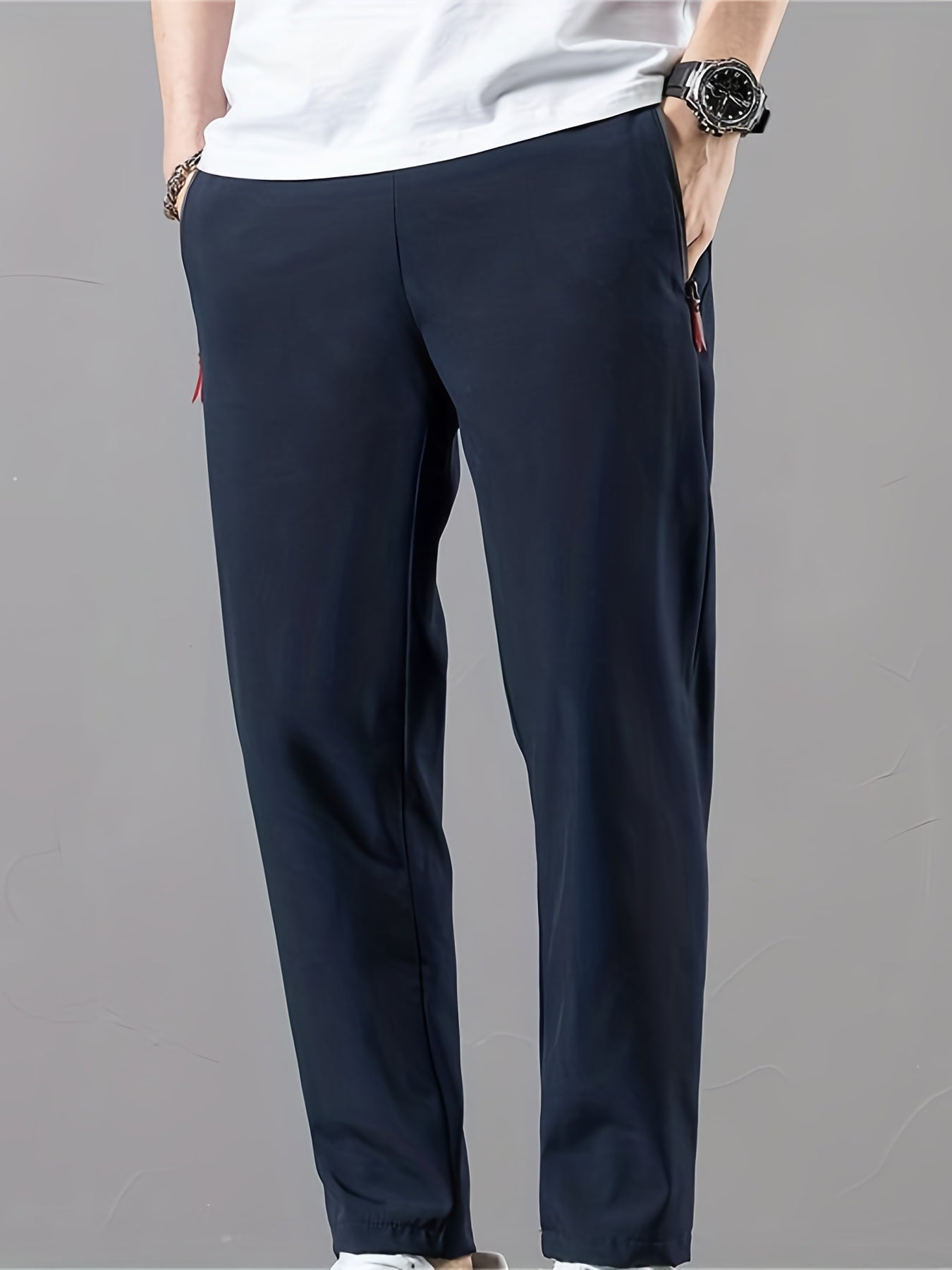 Casual men's pants with stretch, drawstring and zipper for spring and summer sports.