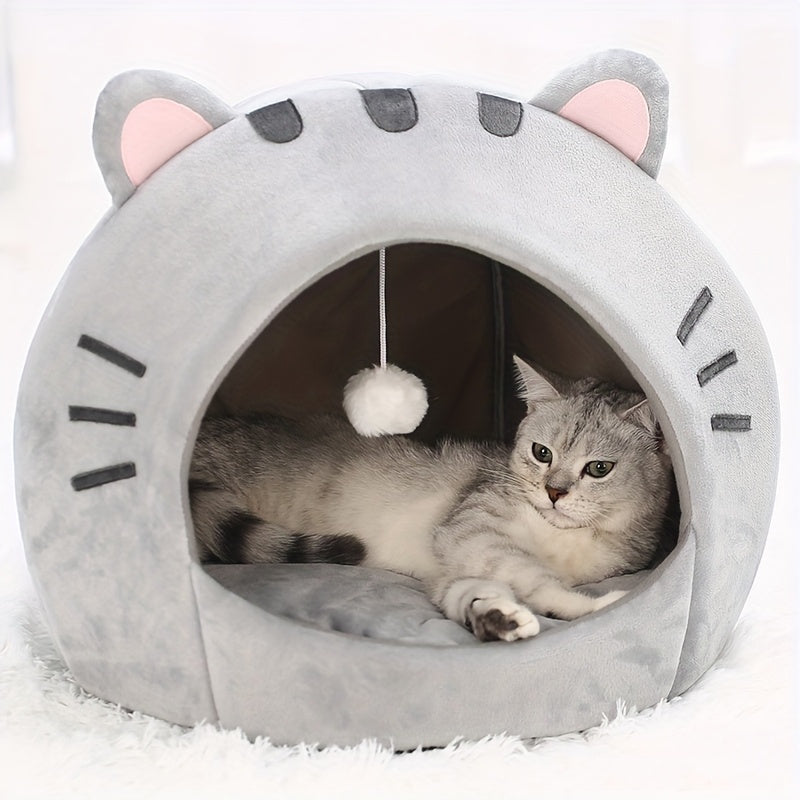 Gray hooded cat bed with pink ears, soft interior, and washable cushion - ideal for snuggling and napping indoors.