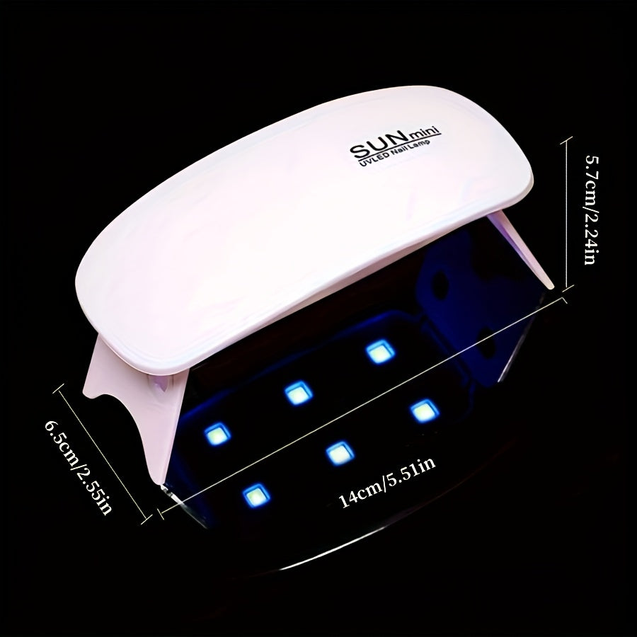 Portable mini nail lamp with 6 UV/LED light beads in pink and white. USB powered, foldable design, suitable for gel polishing and drying. Ideal for hand, foot, and nail care.