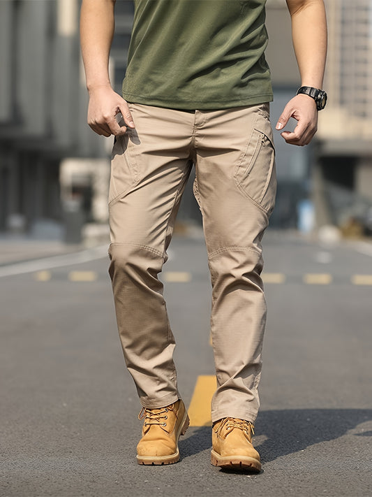 Men's olive green tactical cargo pants made of durable polyester with multiple pockets, perfect for hiking and outdoor adventures. Machine washable and ideal for camping gear.