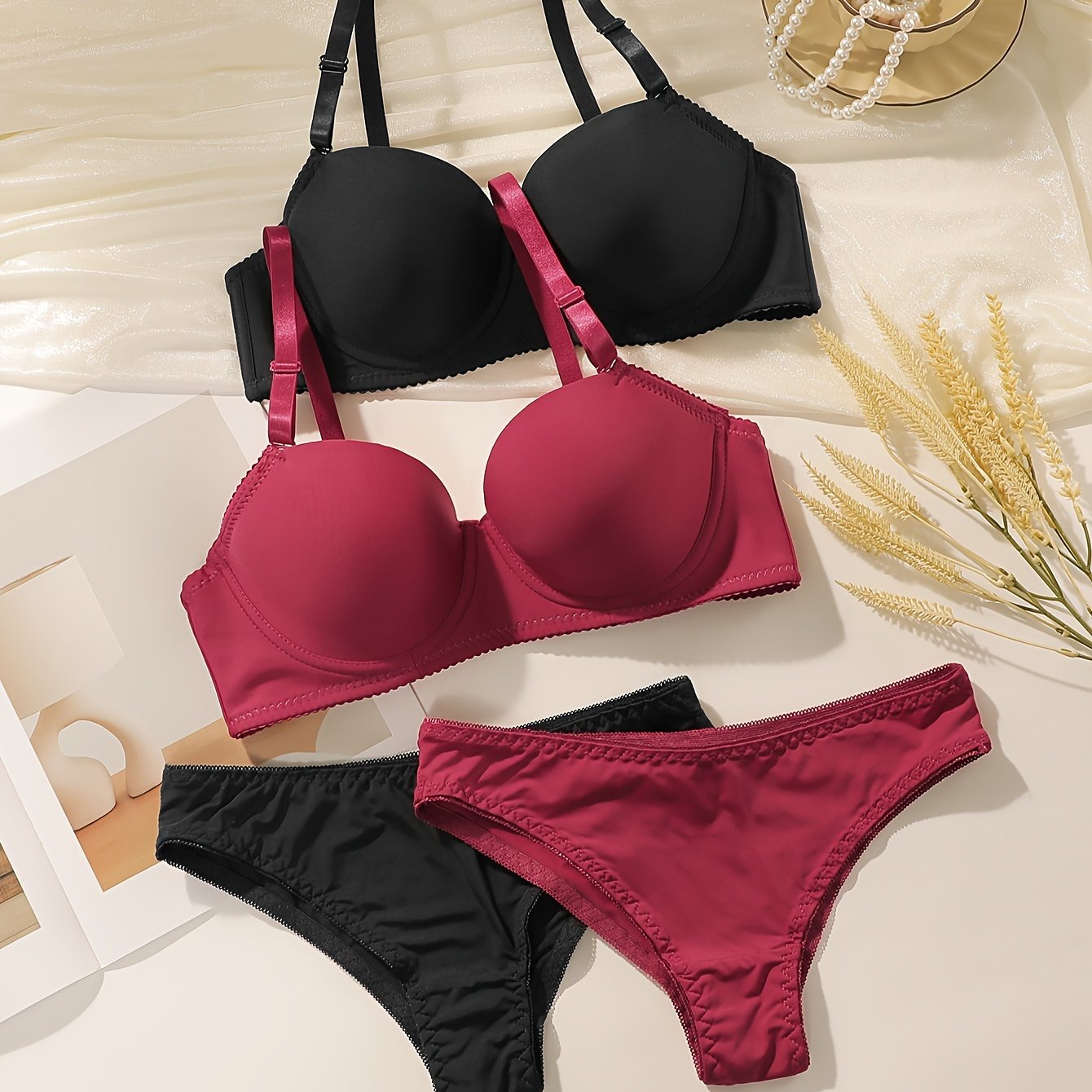 Women's 2-piece Seamless Push-Up Bra & Panty set with underwire support. Made of breathable nylon/elastane blend. Includes black and maroon styles. Hand washable.