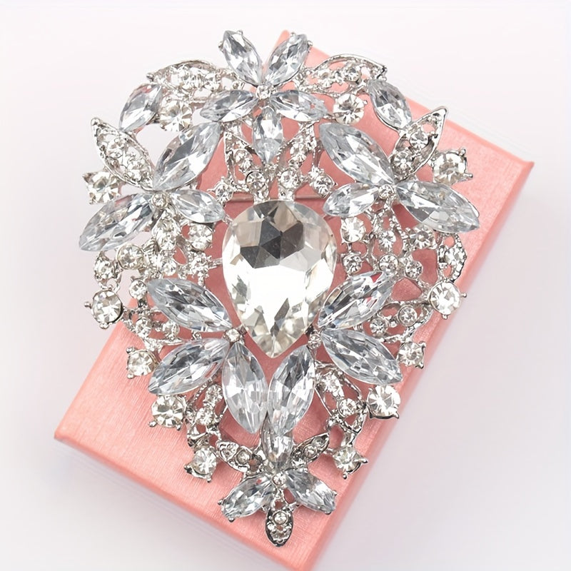 Add a touch of vintage elegance with this stunning Rhinestone Brooch Pin featuring an irregularly shaped large crystal glass design. Perfect for embellishing clothing and adding a luxurious touch to your fashion ensemble.