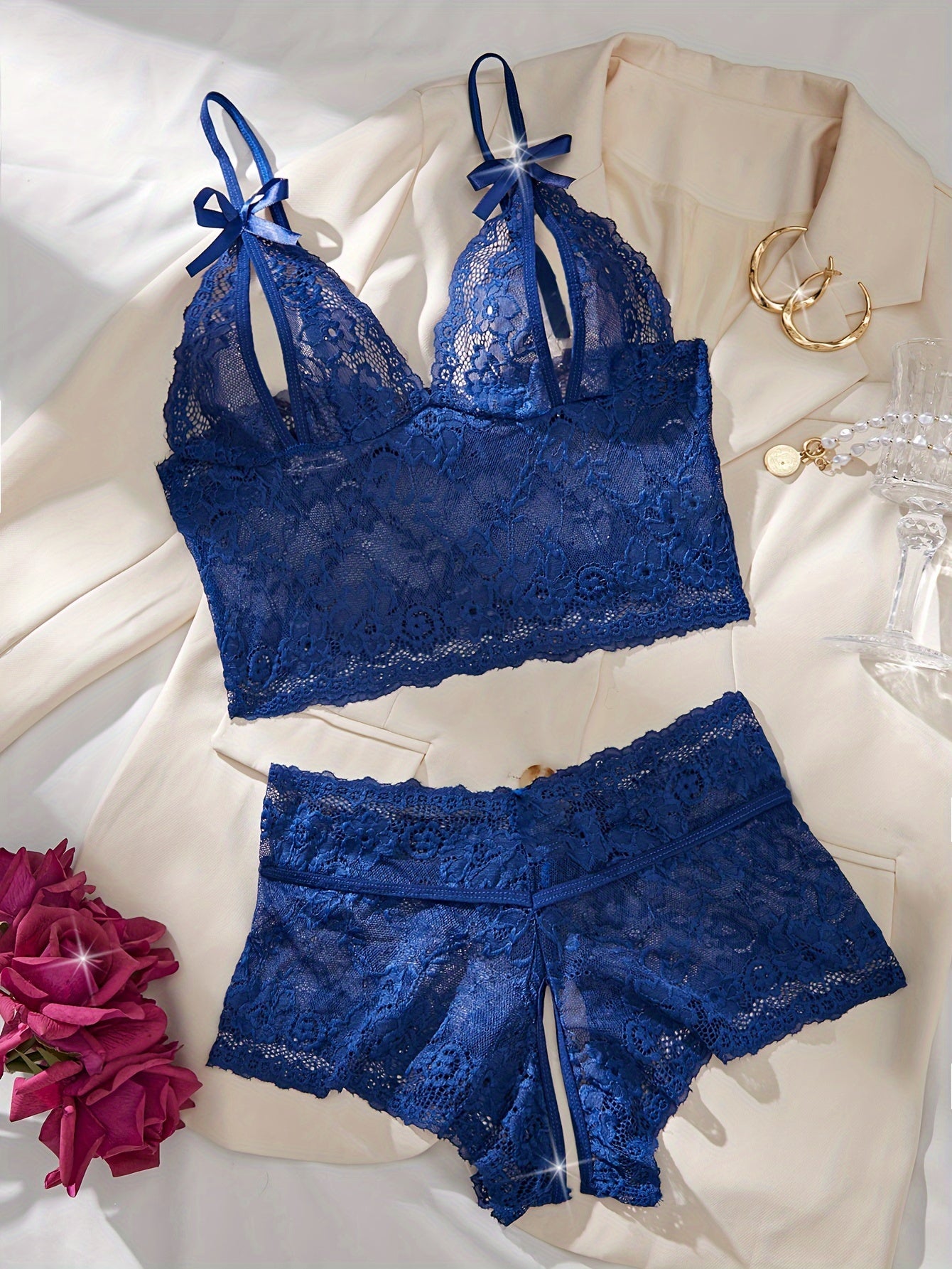 Floral lace lingerie set with bow bra and crotchless panties for a seductive look.