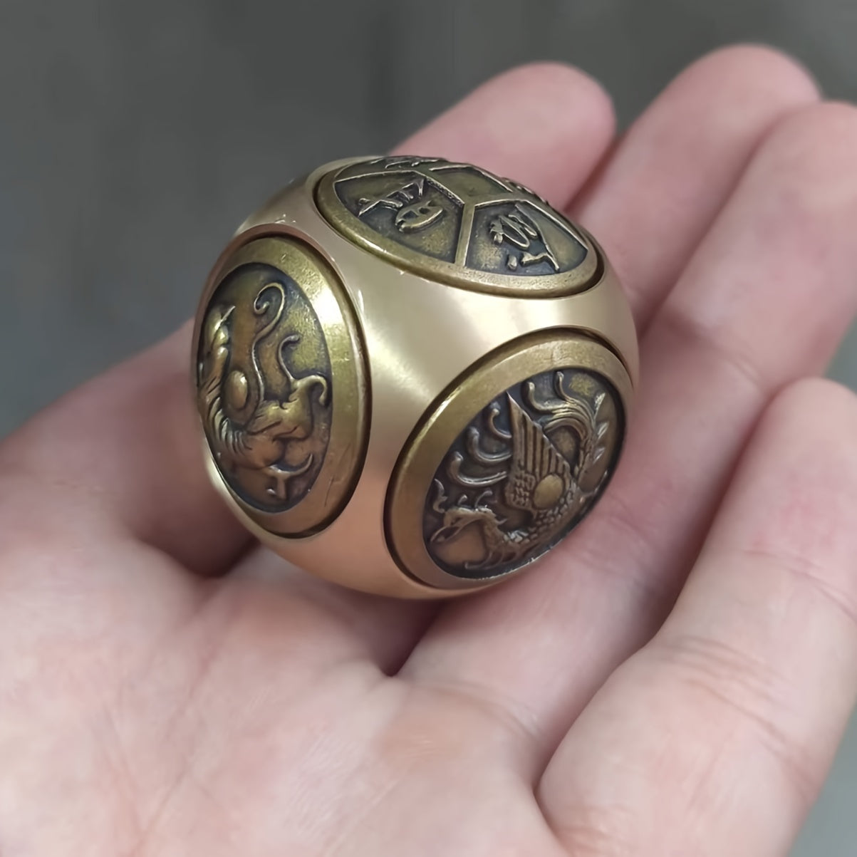 Brass stress relief sphere for prosperity and good fortune.