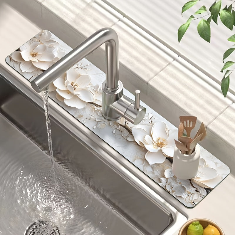 Add a touch of elegance to your kitchen or bathroom with this 3D floral faucet mat in white. Made of durable and moisture-proof polyester, it is splash absorbent and features a suction cup for easy installation. Perfect for adding some style to your