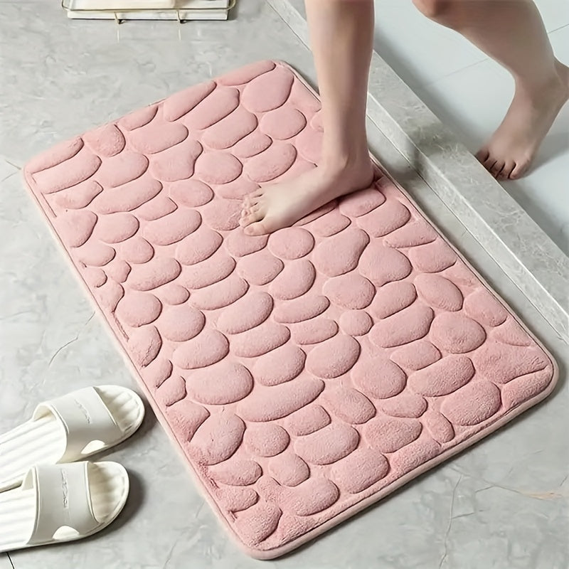 Soft, non-slip coral fleece bathroom mat in a pebble pattern. Quick-dry, machine washable, and low pile for comfort and home decor. Made of plush polyester fiber with knit fabric and 100% polyester material. 570gsm and 1.4cm thick.