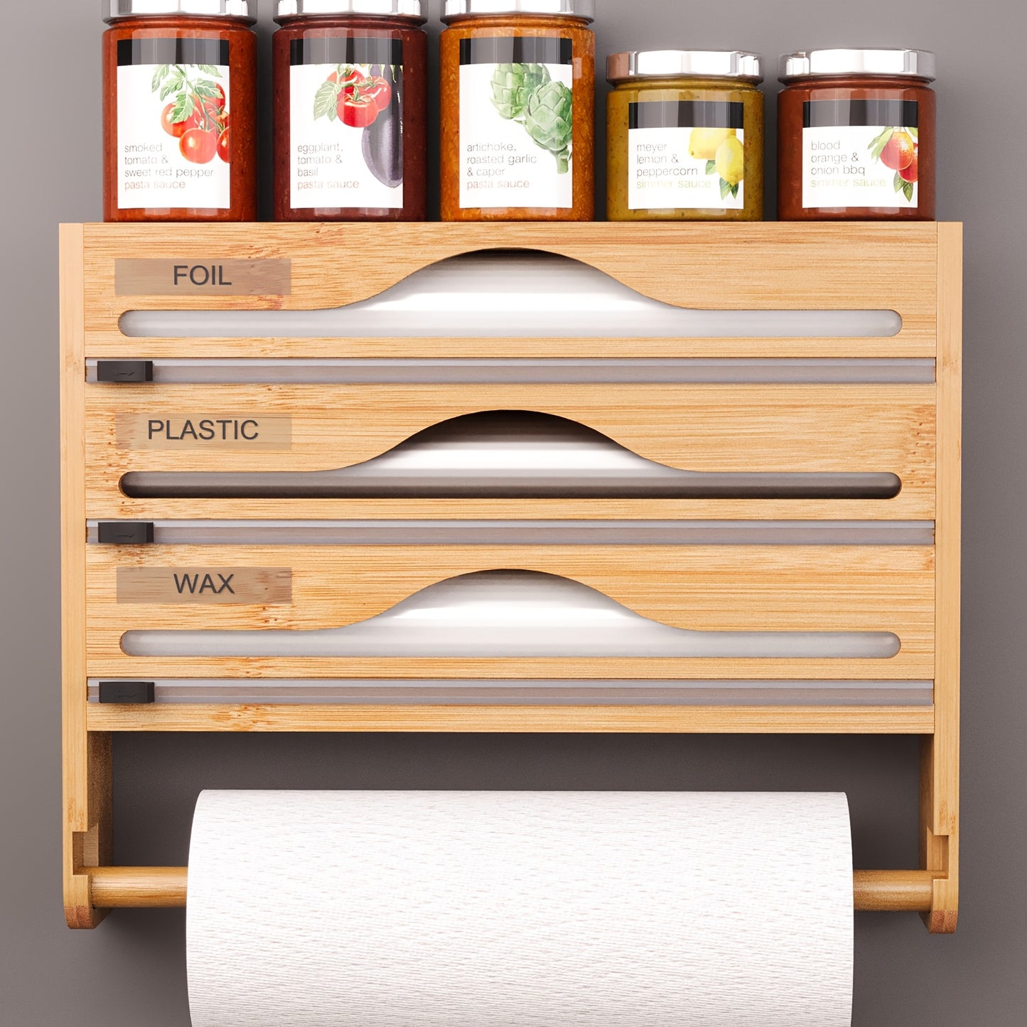 Bamboo wrap organizer with cutter and labels for wall-mounted kitchen storage.